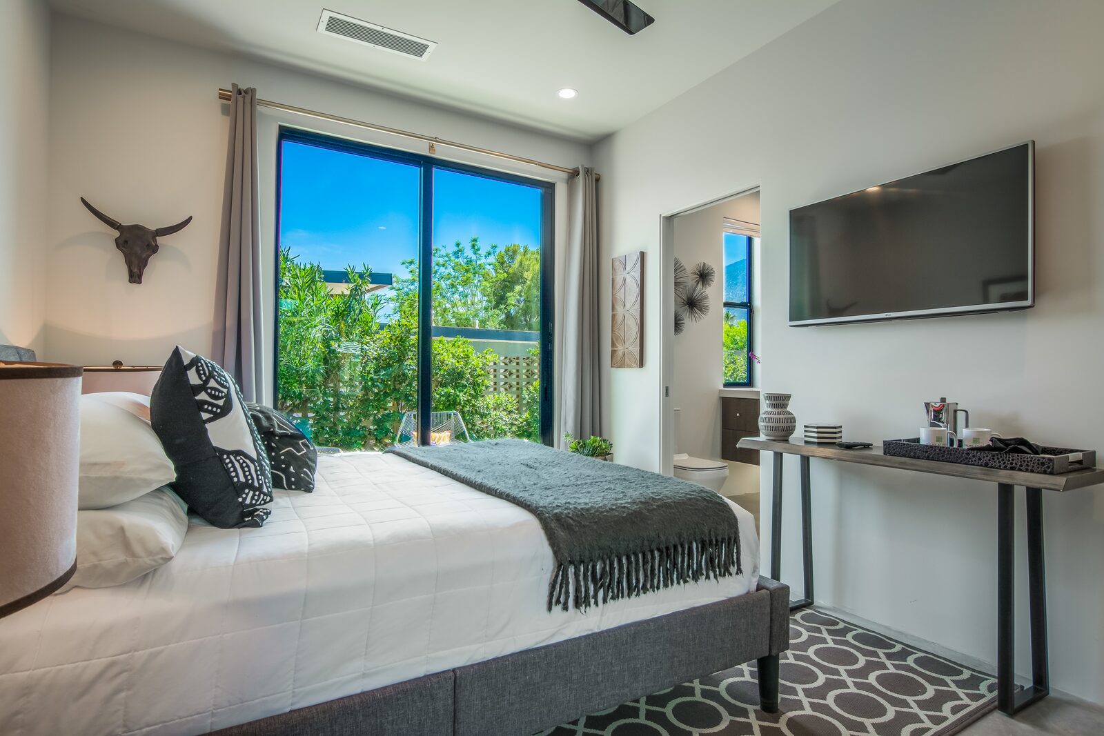 5 Palms Estate guest bedroom with sliding doors and mountain view