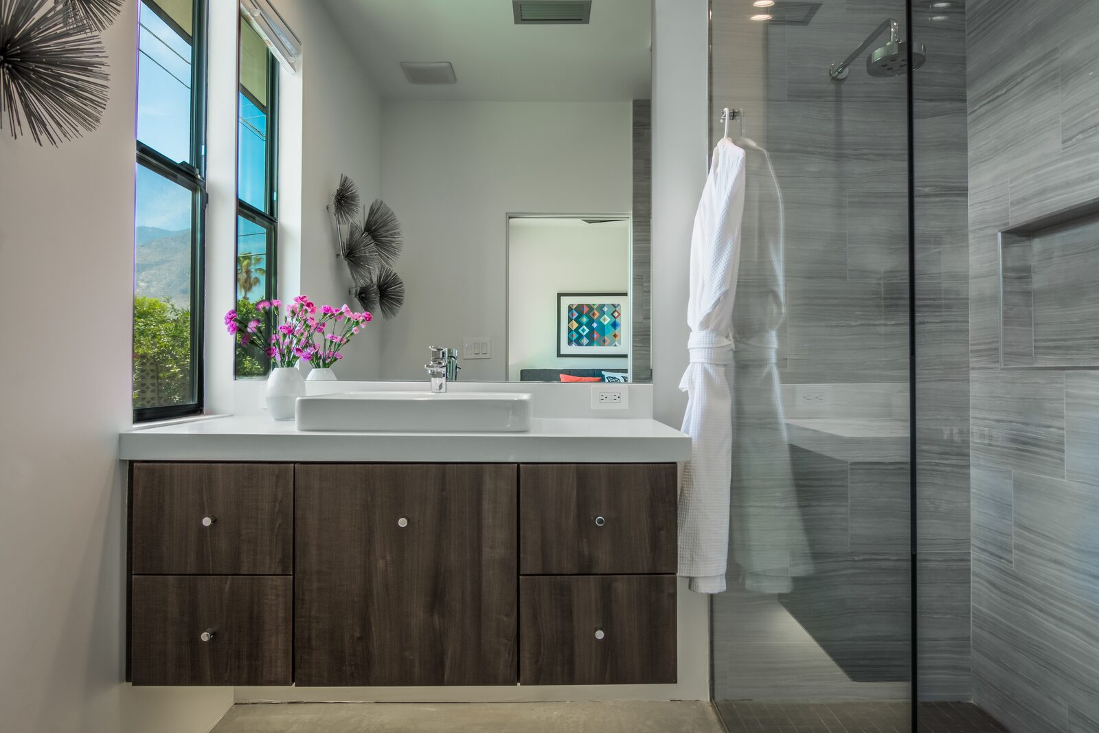 5 Palms Estate en-suite bathroom with dark cabinetry and pink accents