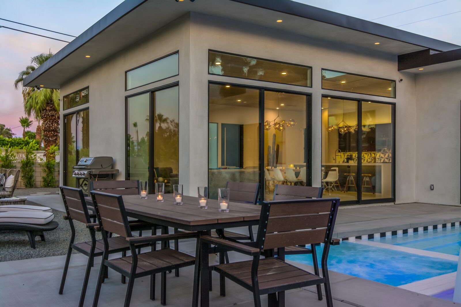 5 Palms Estate outdoor dining table beside the pool
