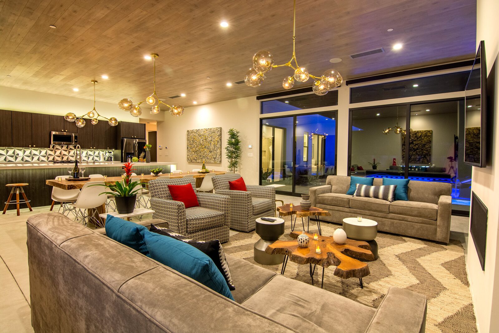 5 Palms Estate great room at dusk with warm lighting and layered rugs