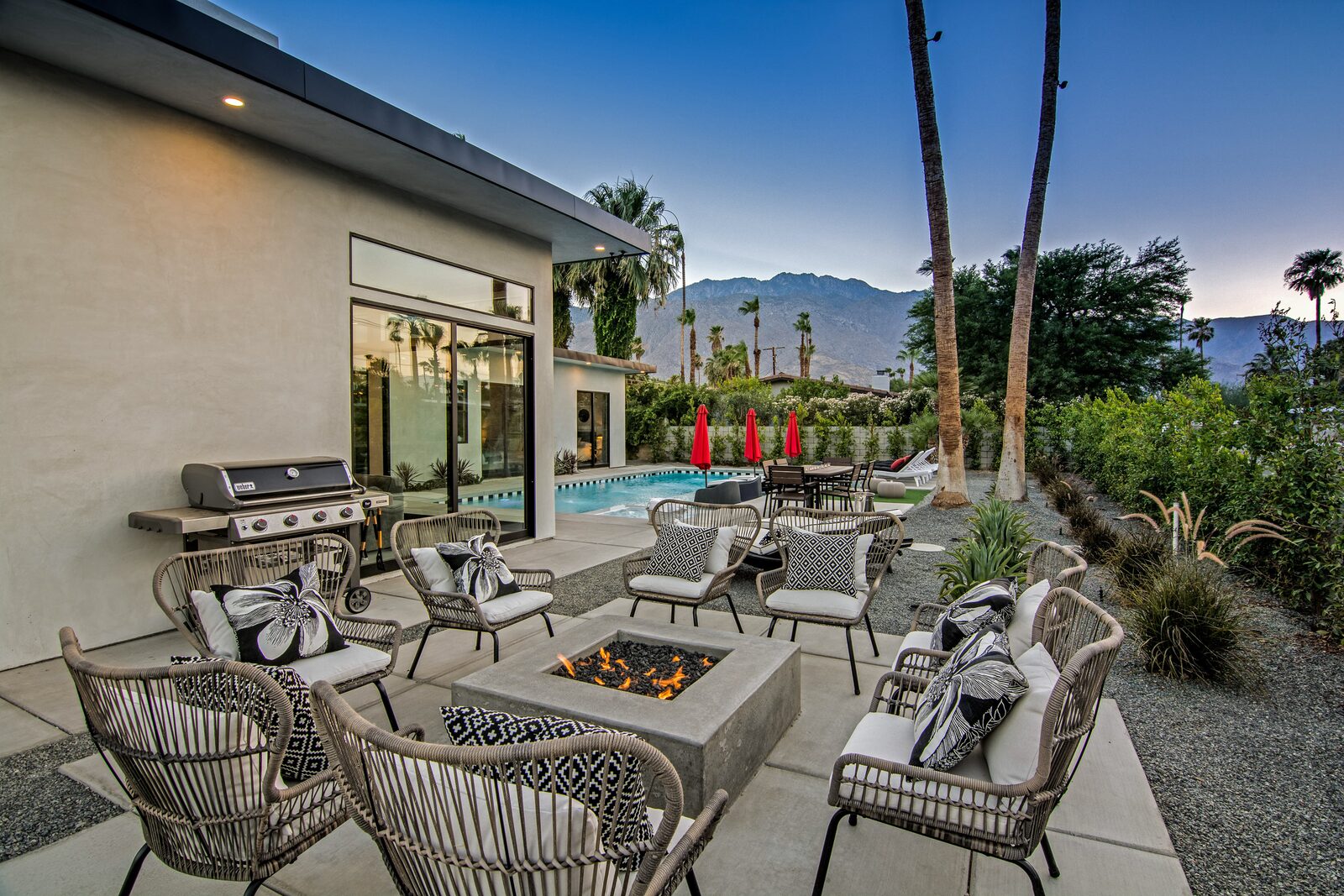 5 Palms Estate outdoor fire pit lounge and dining beside the pool