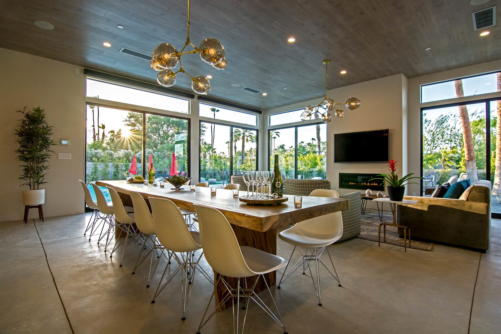 5 Palms Estate great room with pendant lights and long dining table