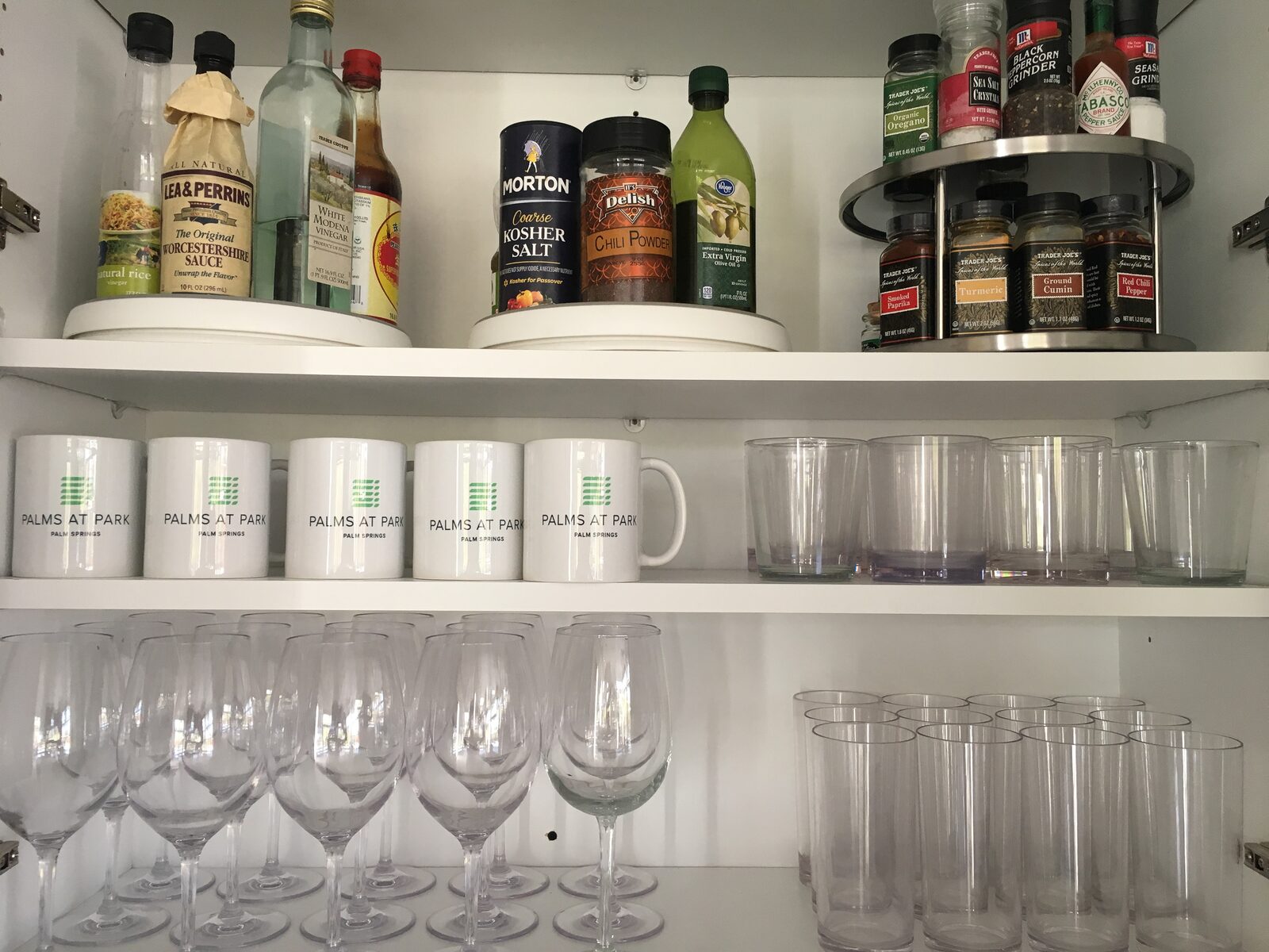 Palms at Park Villa bar detail with glassware and branded mugs