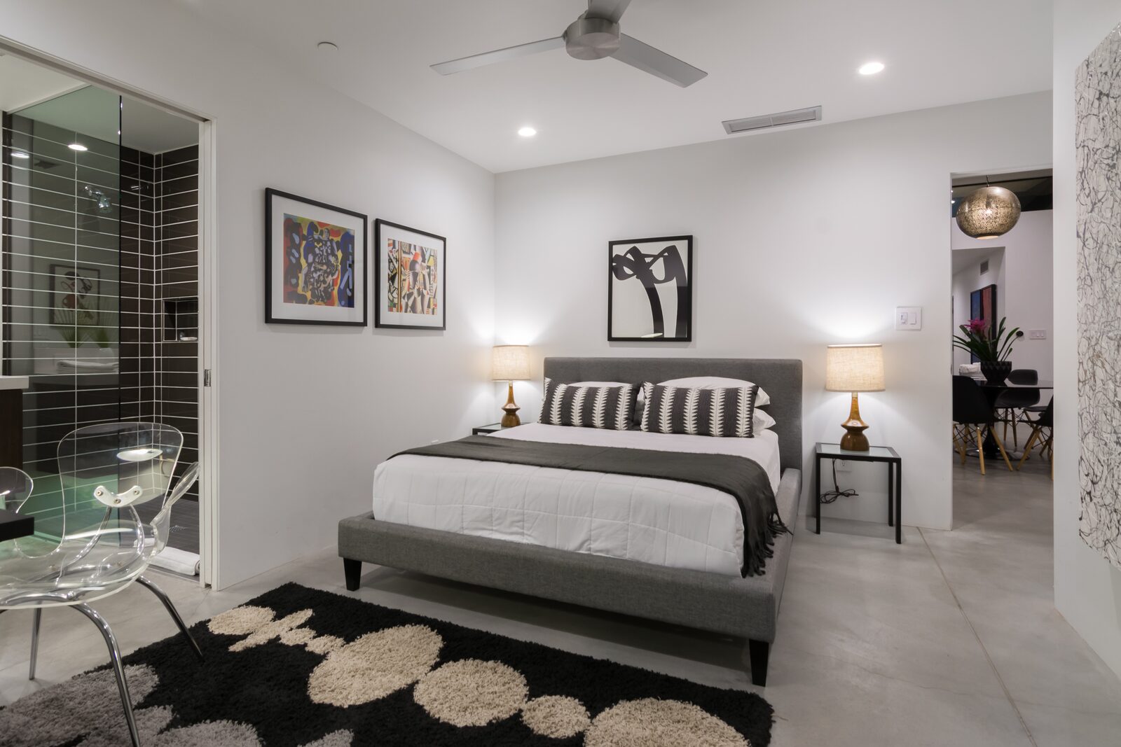 Palms at Park Villa guest bedroom with framed art