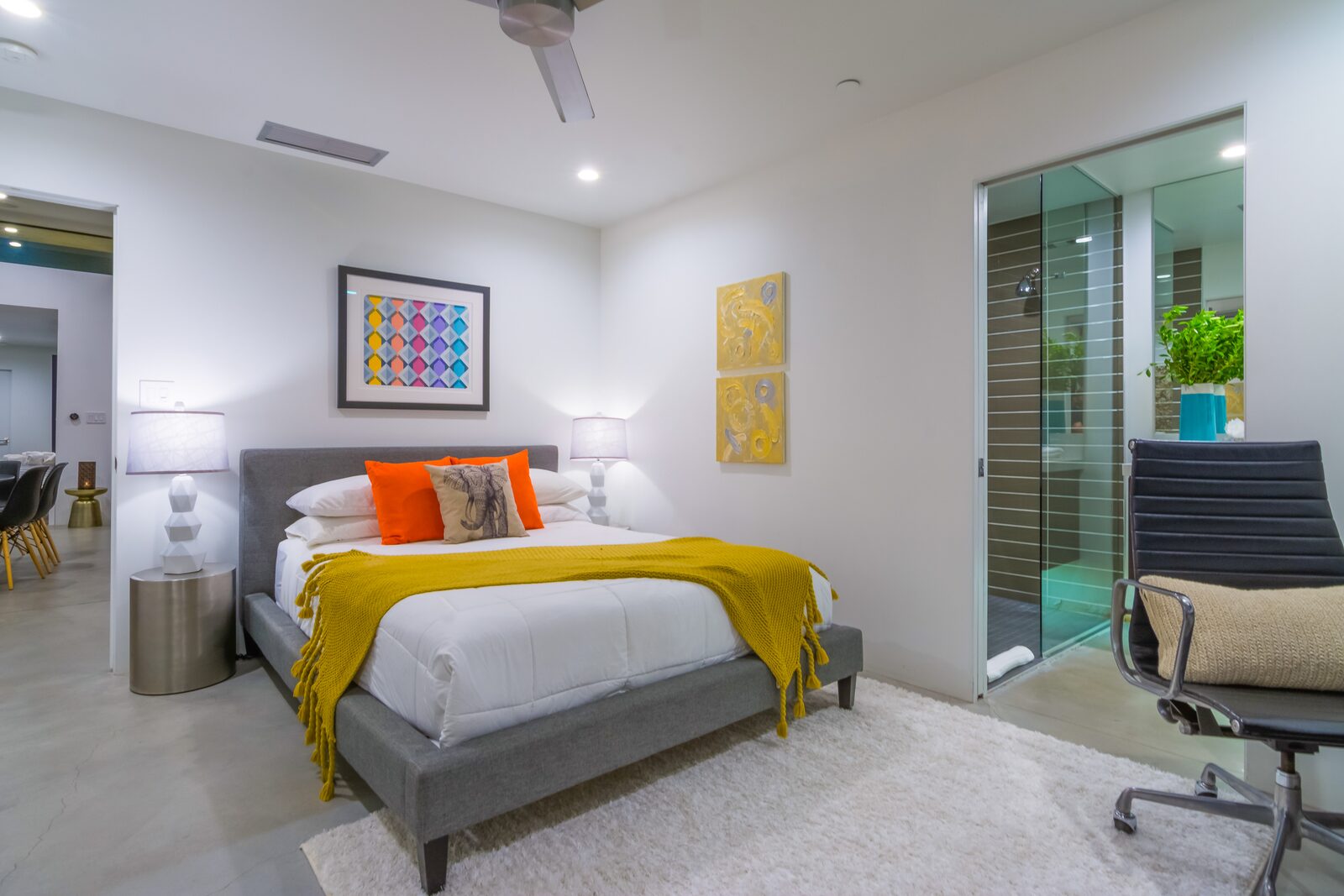 Palms at Park Villa bedroom with warm accents and wood floor
