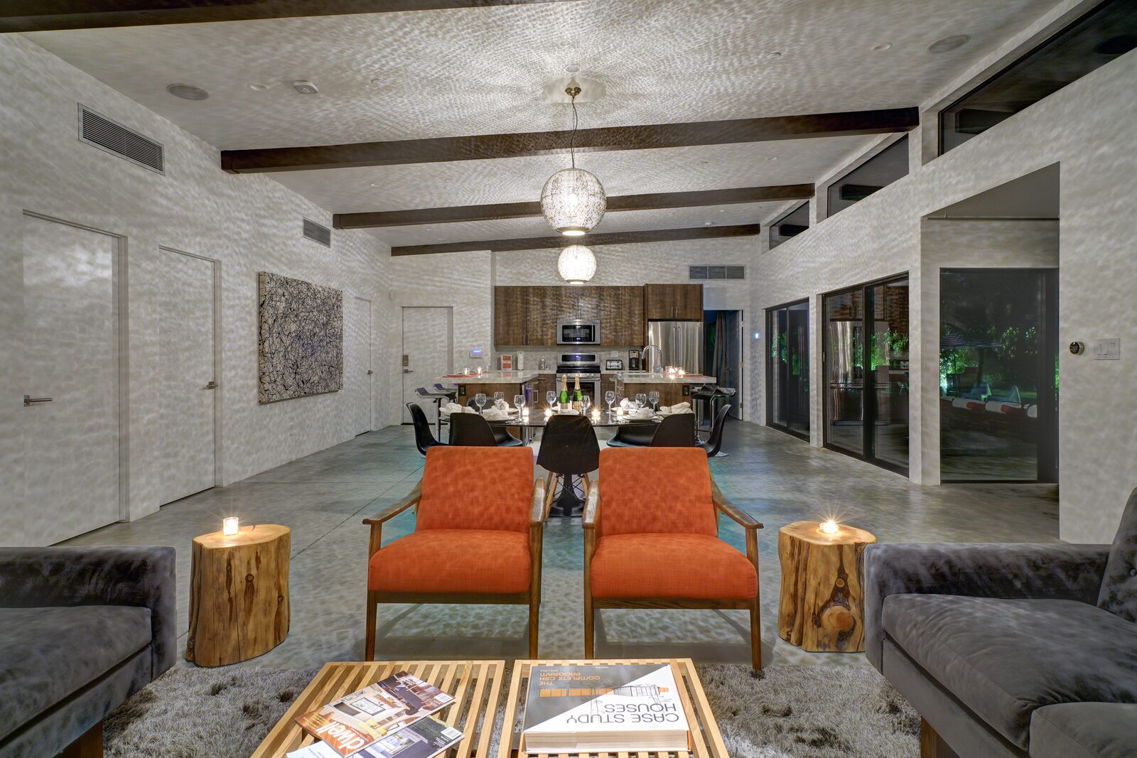 Palms at Park Villa lounge with orange chairs and coffee table