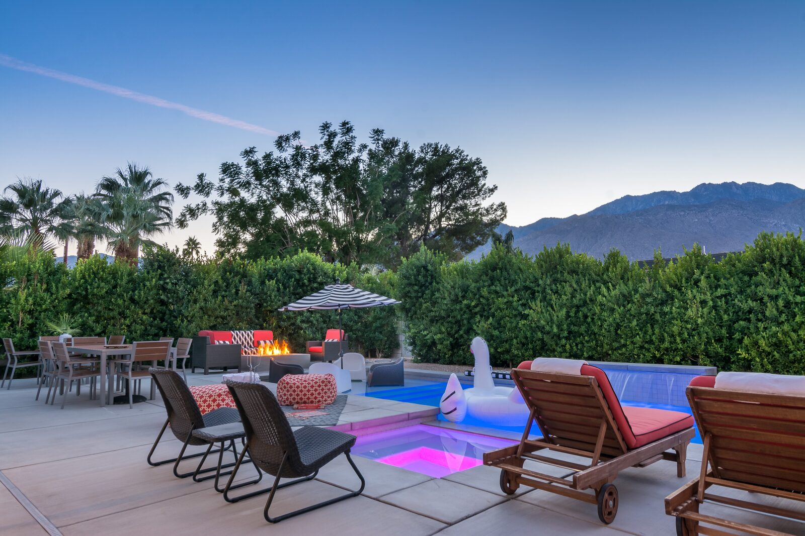 Palms at Park Villa outdoor daybed lounge with striped umbrella