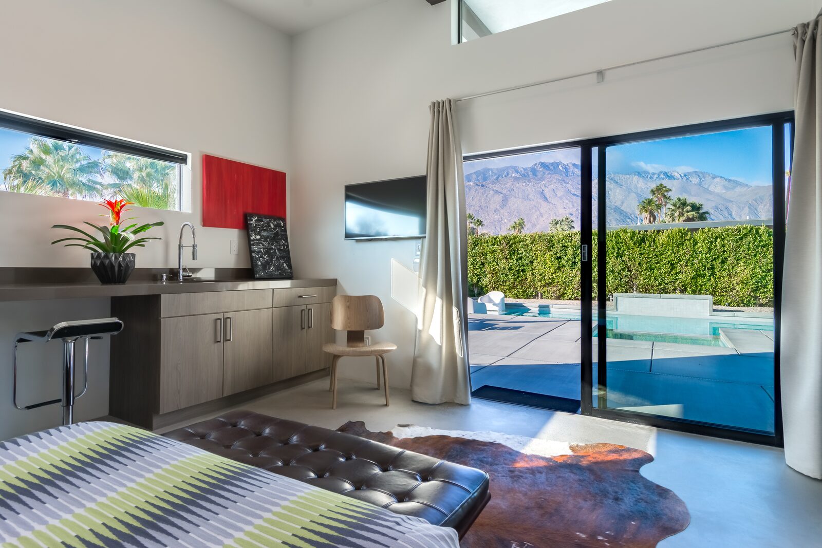 Palms at Park Villa bedroom with sliding doors to the pool