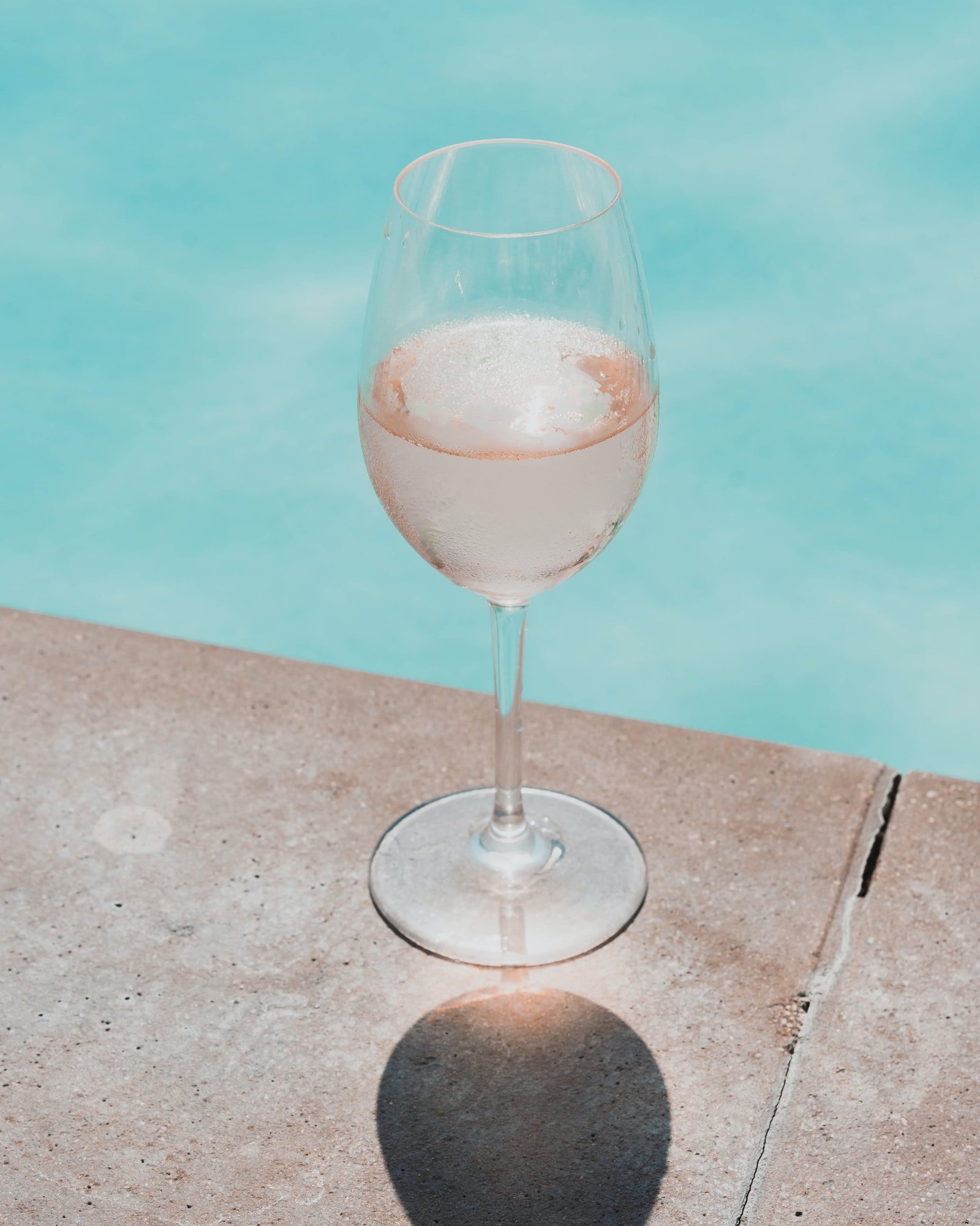 Poolside glass of wine on a warm Palm Springs July day